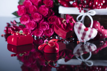 Valentines day concept background. Roses, gifts, romantic decorations. Place for text.