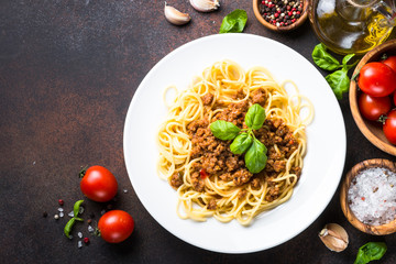 Spaghetti bolognese  on dark stone table.