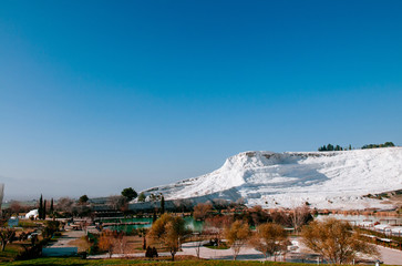 White calcium limestone landscape and thermal pool in Pamukkale, Denizili, Turkey