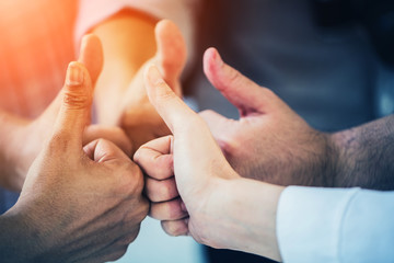 group of business teamwork hand togetrher with thumbs up for successful deal and concept