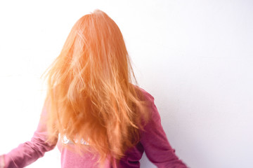 Blonde furious woman pulling blonde hair out of head. Emotional young girl showing her bad expression, motion portrait