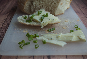 Sliced unleavened bread and fresh white cheese with green onion. Healthy food.