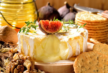 Camembert oven baked served with honey, walnuts and fresh figs.