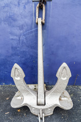 Large anchor leaning of a wall.