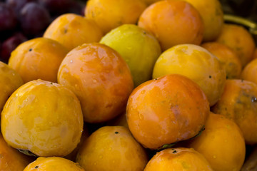 Fresh large persimmon in a water drops