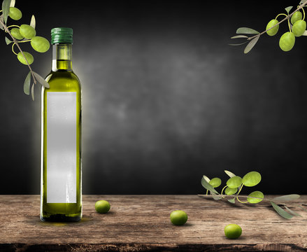 bottle of oil with branches and olives on rustic wooden table