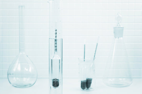 Measurement of liquid density in a lab, toned