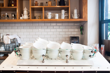 Coffee cups on counter in modern cafe, Interior coffee shop