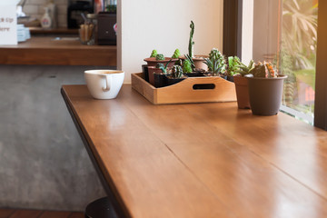 Wooden table near glass window in cafe, Interior design, Lifestyle