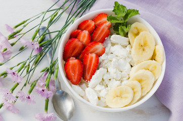 Healthy breakfast, cottage cheese with fruit.