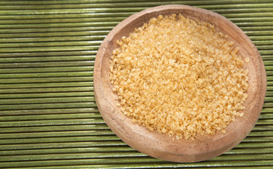 Brown sugar in the wooden bowl