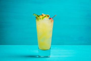 Sweet cocktail with pineapple and rum. Selective focus.