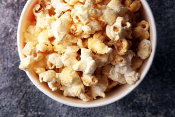Cinema concept with popcorn in red white bag