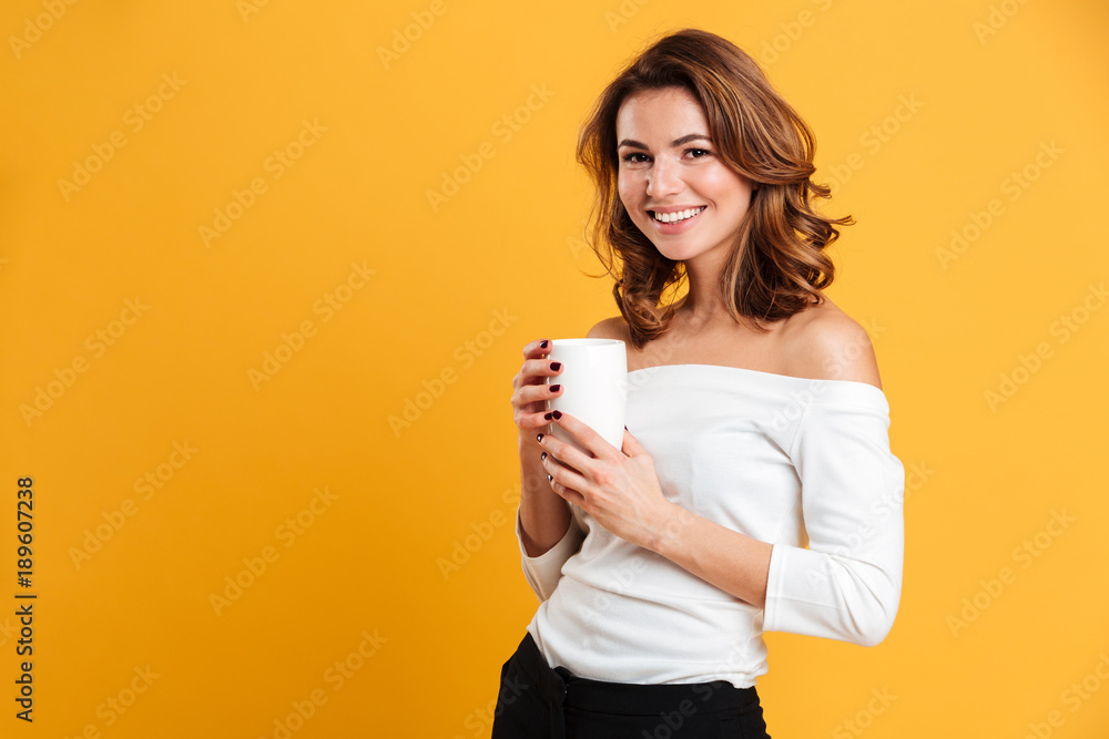 Canvas Prints Beautiful young woman drinking tea.