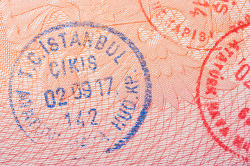 Turkish visa stamps in a passport, close up.
