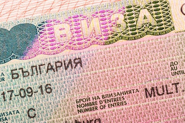 Obraz premium Bulgarian visa stamp in a passport, closeup, selective focus. Translation: «Bulgaria»