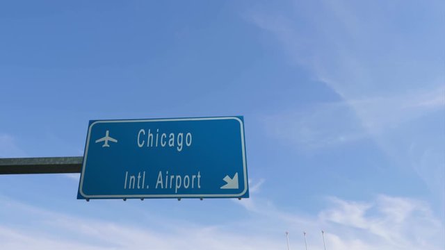 chicago airport sign airplane passing overhead