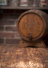 Barrel of whiskey on rustic table.blur bar background