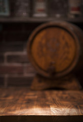 Barrel of whiskey on rustic table.blur bar background