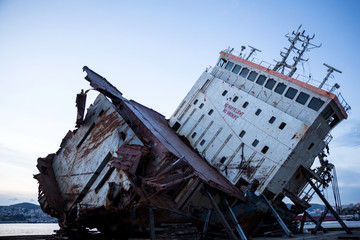 Part of a cargo shipwreck exterior, closeup background.