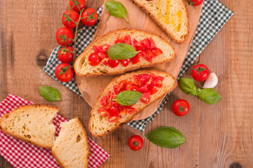Bruschetta bread with basil and chopped tomatoes. 