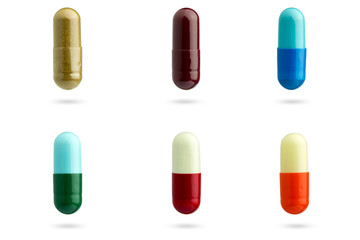 Closeup set of multicolor capsule medication on white background. Suitable for use in medical or health articles.