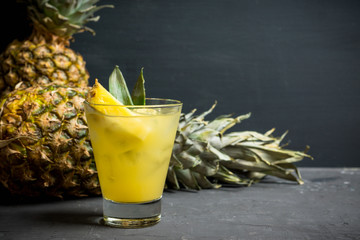 Sweet Mai Tai cocktail with pineapple and rum. Selective focus.