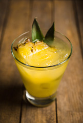 Sweet Mai Tai cocktail with pineapple and rum. Selective focus.
