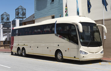 Luxury tour bus with large wing mirrors
