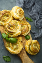 Pies with green basil pesto sauce
