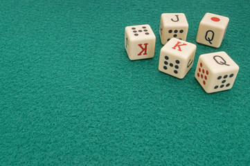 poker dice on mat