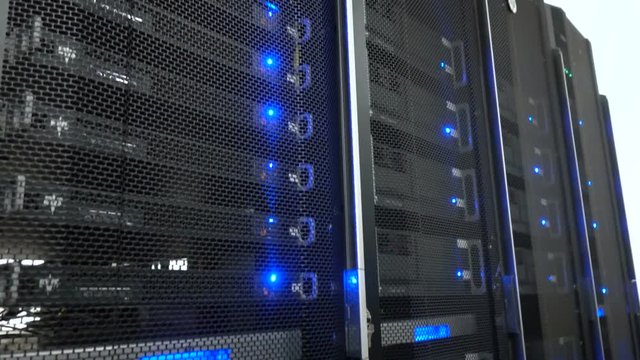Server room. Web internet and network telecommunication technology, big data storage and cloud computing computer service business concept. Motion shot. flashing lights. 