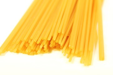 Italian pasta Spaghetti  ready for cooking. Isolated on the white background. Healthy eating concept.