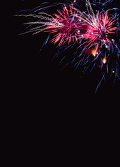 Colorful firework on the night sky. New Year celebration fireworks. Abstract firework isolated on black background with free space for text
