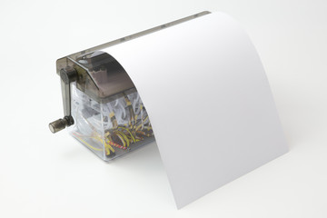 Paper in portable document shredder with clipping path on white background