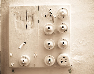 a colection of old worn light switches painted