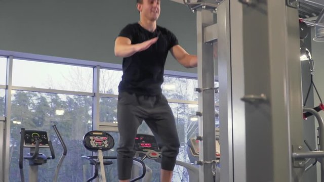 Sportsman jumps in the gym