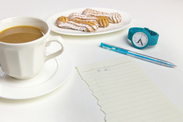 To do list with a morning coffee on a white background