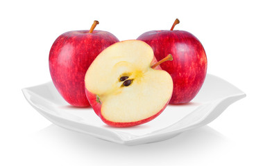 red apple in ceramic plate (beautiful shape) on white background