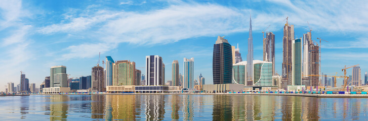 Fototapeta na wymiar Dubai - The panorama with the new Canal and skyscrapers of Downtown.