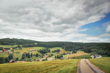 Fototapeta na wymiar Houses and fields of the German Farmers.Black Forest. Germany.