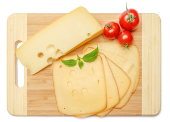 swiss cheese or cheddar and tomatoes on white background