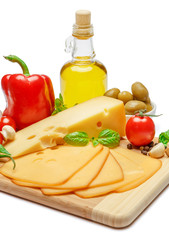 swiss cheese or cheddar and vegetables on white background