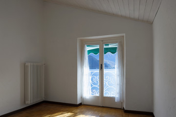 White room with lake view. Nobody inside