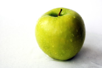 Green apple. Useful fruit. Source of iron. Fruits for a diet. Vegetarian food. Diet. Vitamins.