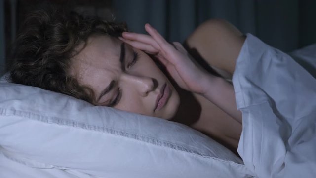 Headache, Depressed Restless Female Awaking from Sleep in Bed