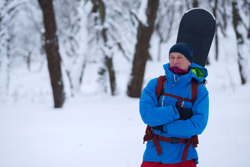 Portrait of satisfied snowboarder