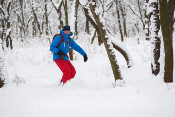 Snowboarder is riding in a deep snow