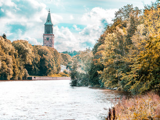 By the water