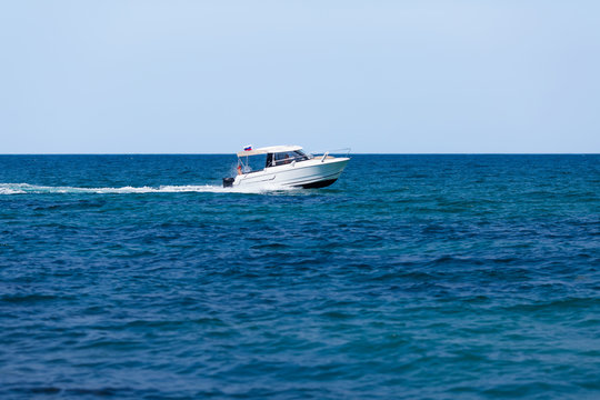 Fototapeta Seascape white motor yacht